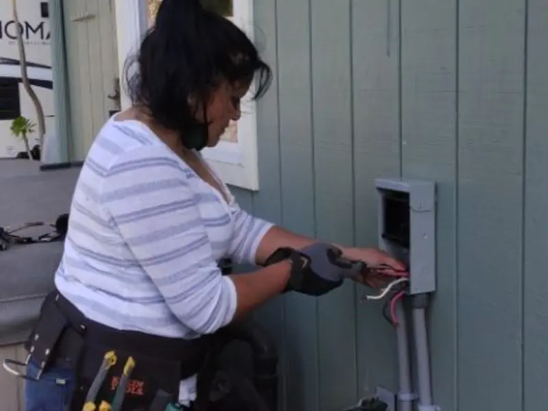 Licensed electrician wiring an exterior subpanel in Strasburg